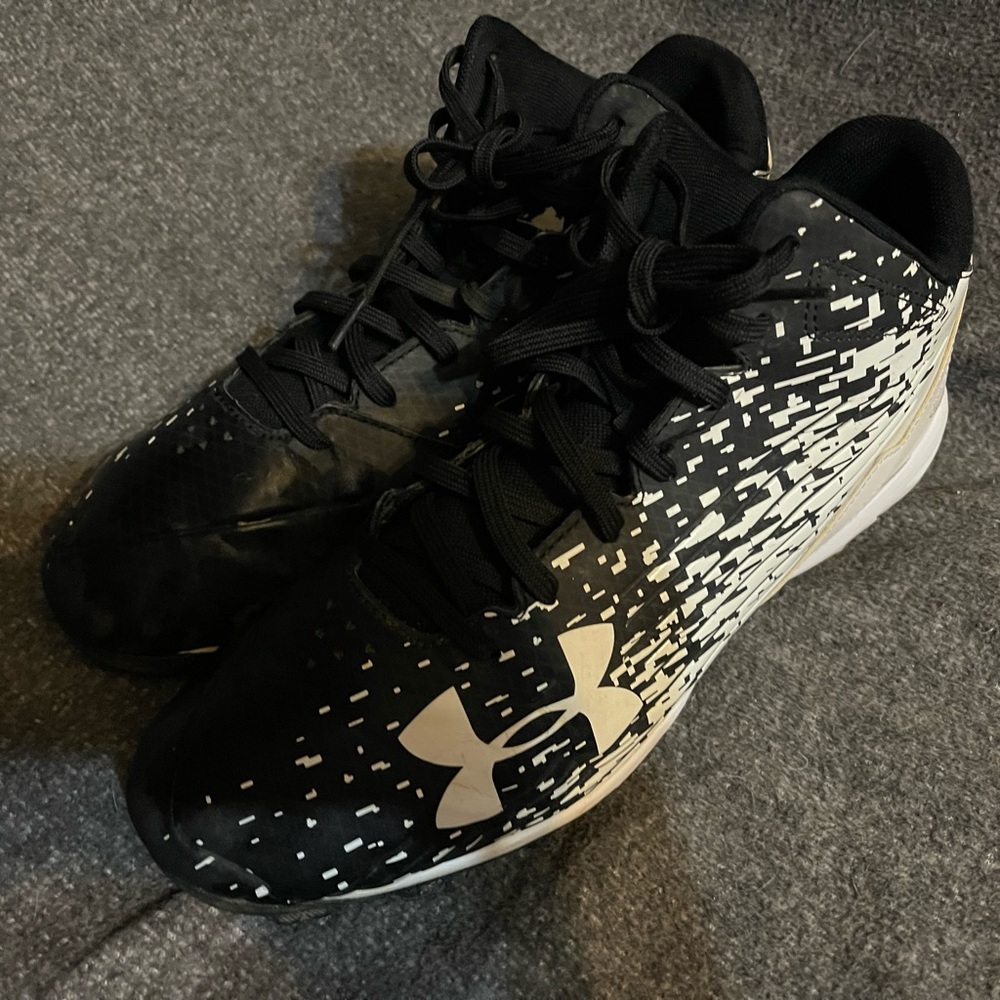 Women’s Under Armour softball cleats size 11.
